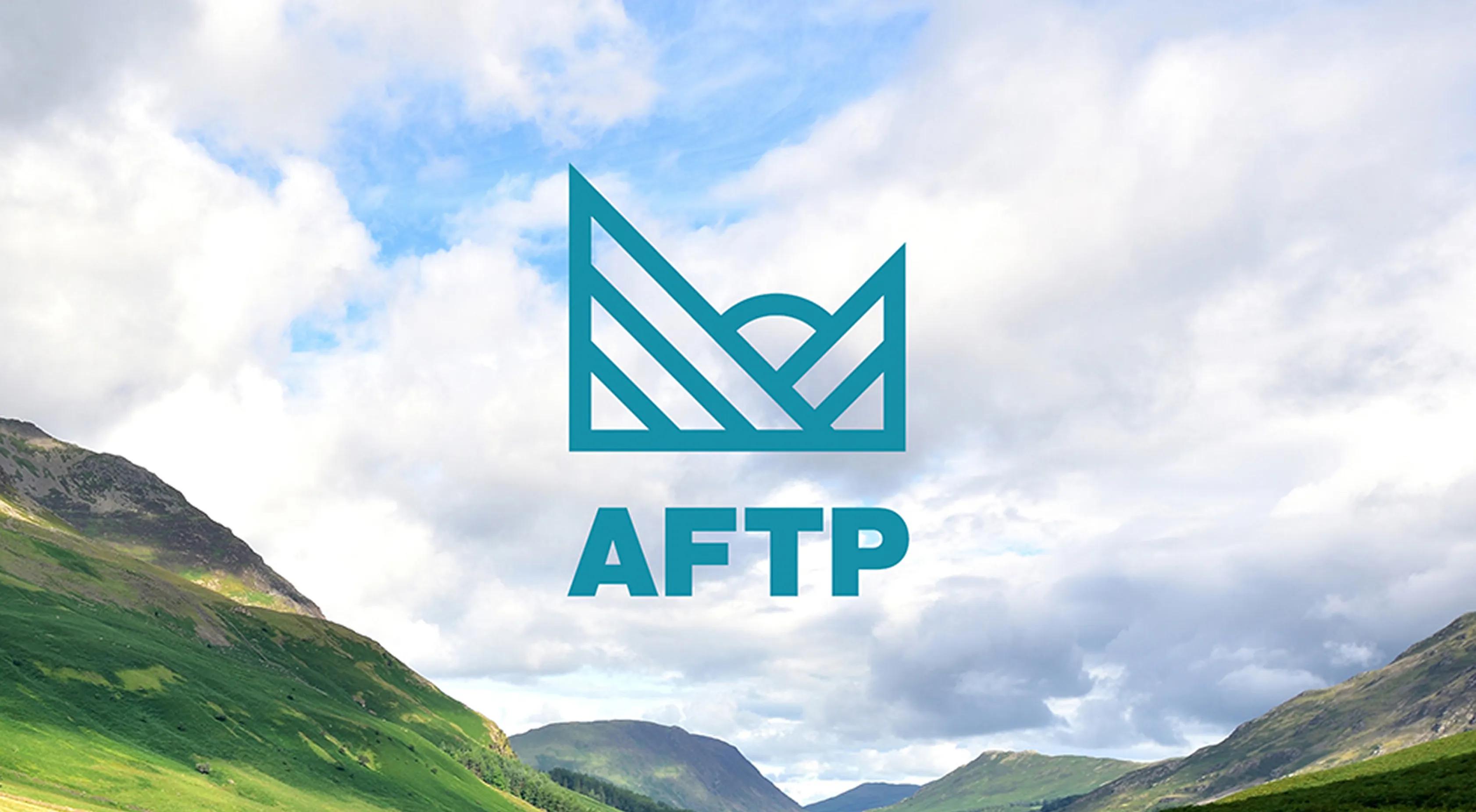 Logo shown in front of mountains