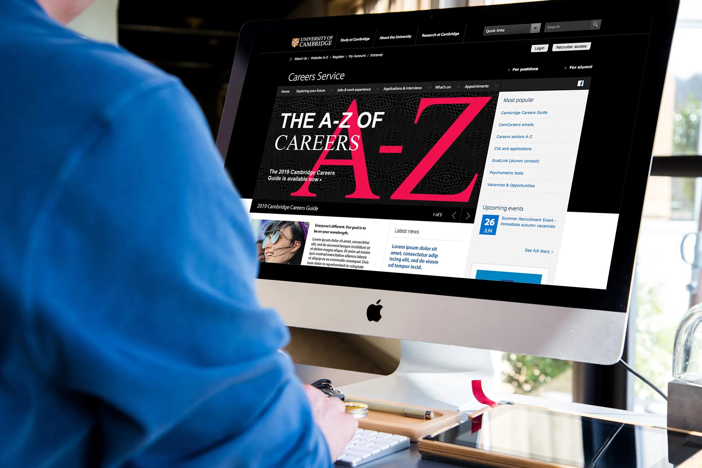 Someone on a computer which shows the landing page for the careers service