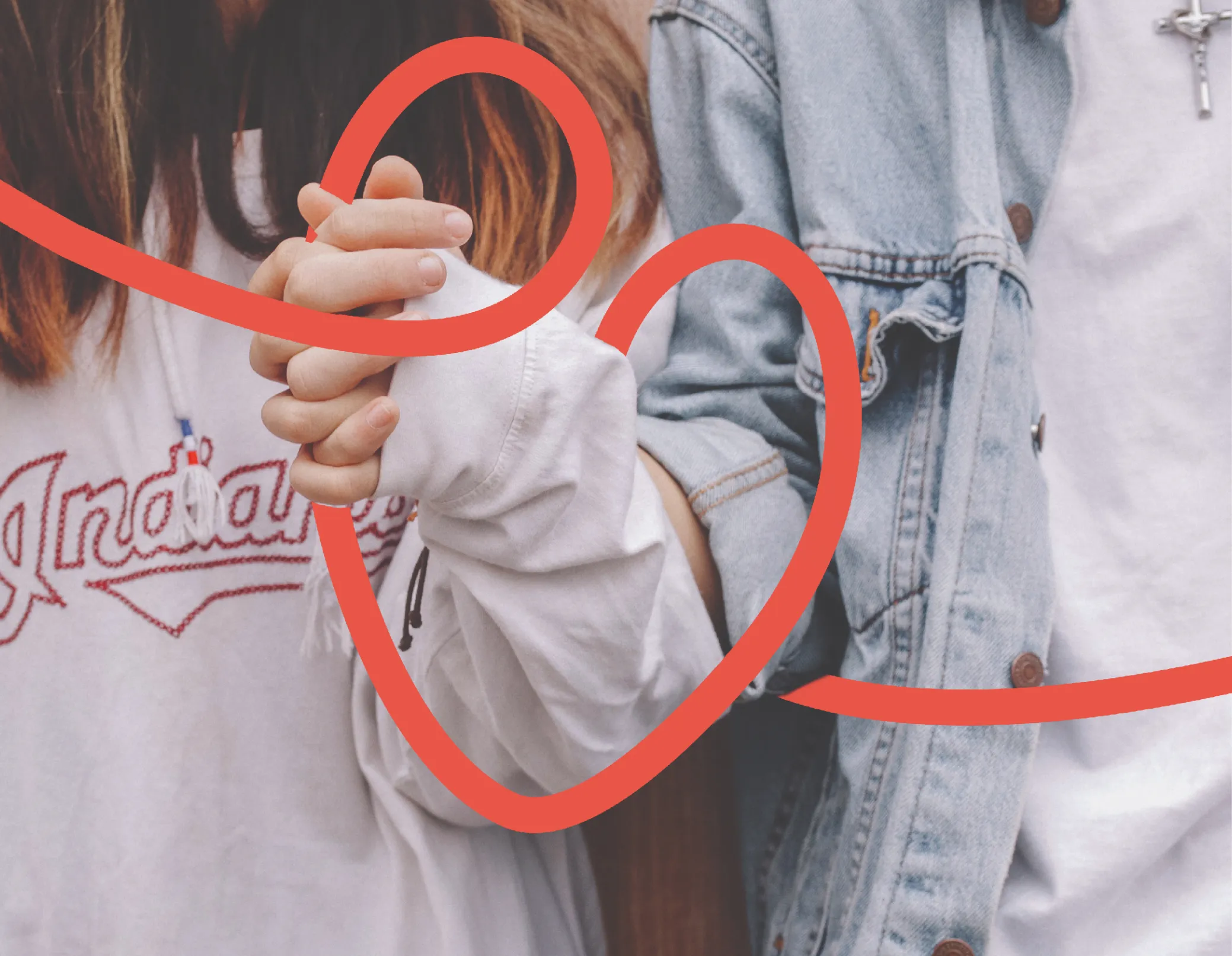 two people holding hands with a line art of a heart weaving between them